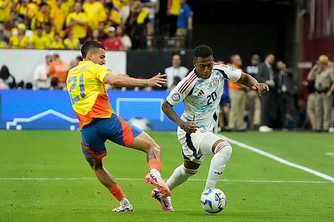 Daniel Munoz and Josimar Alcocer battle for the ball